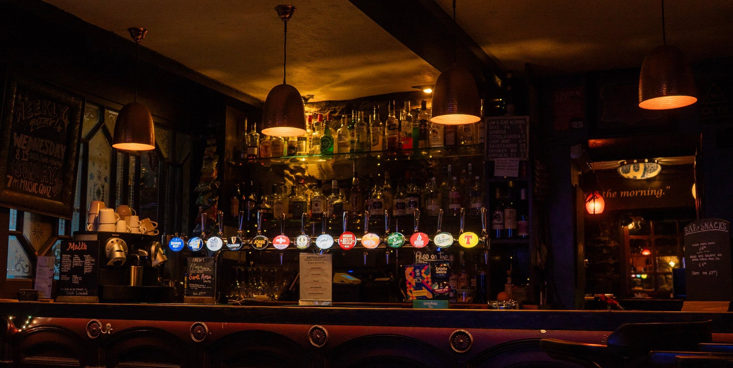 The bar under its lamps