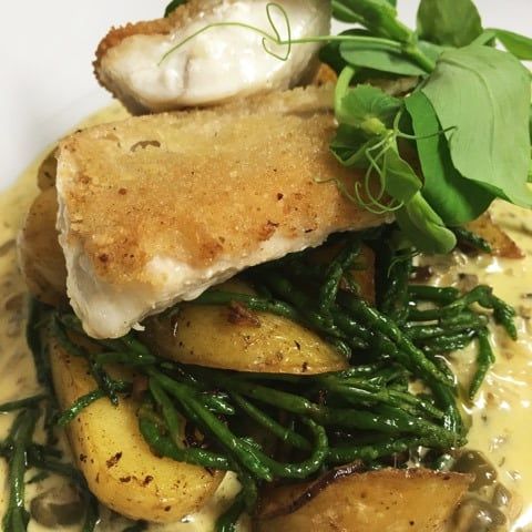 Fish over potatoes and samphire from the kitchen