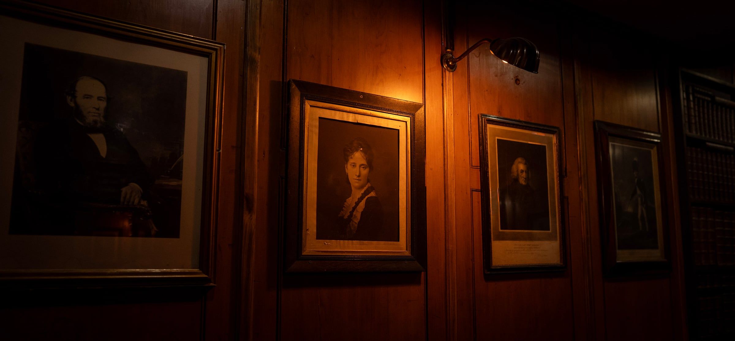 Portraits on the wall of The Antiquary