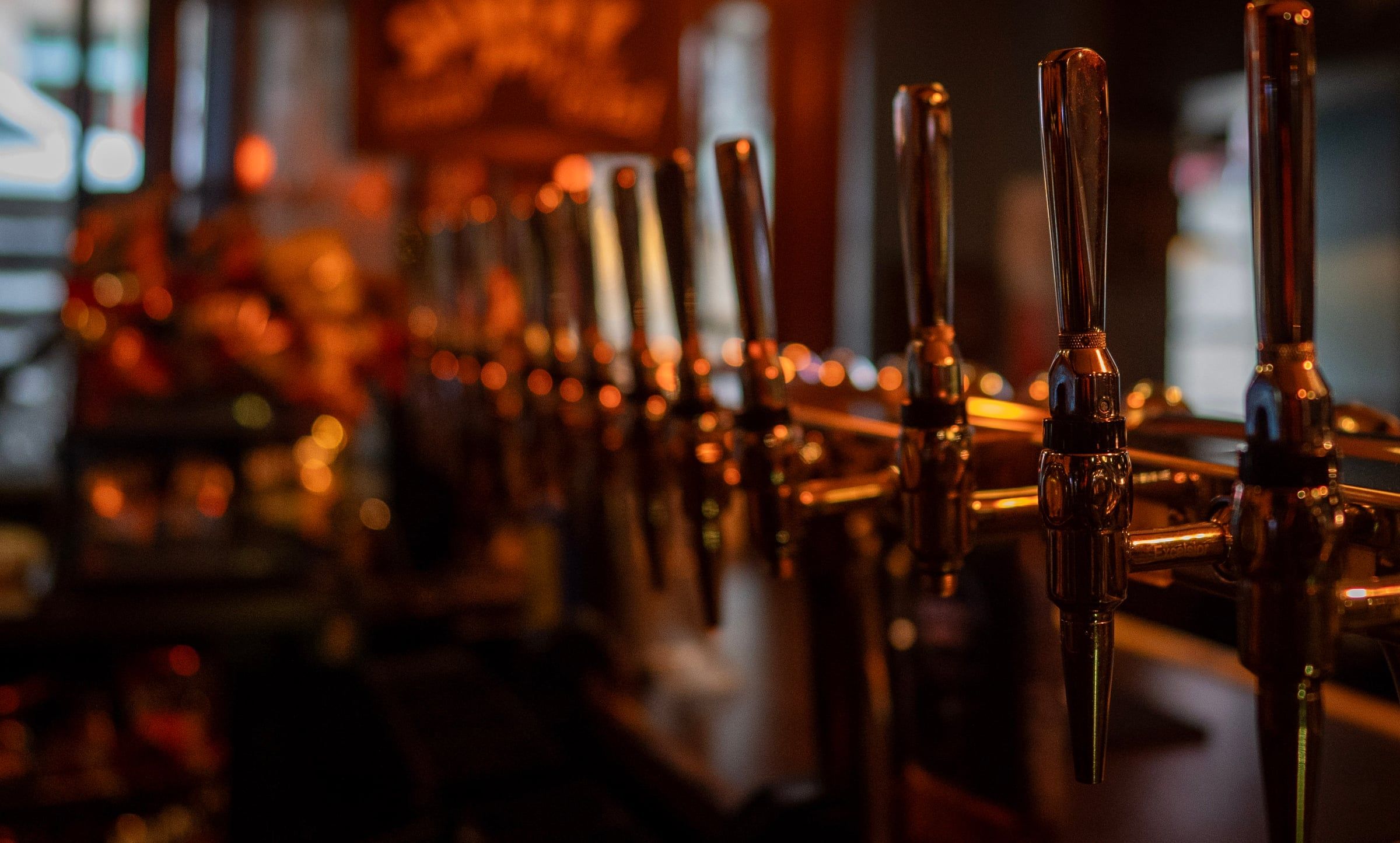 The brass taps along the bar